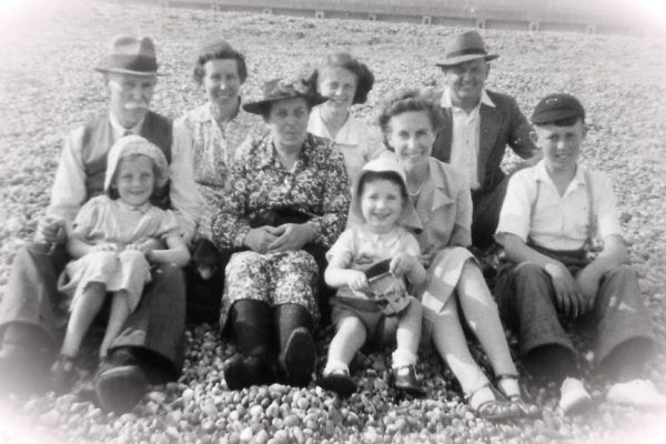 A day at the beach: Mum (far left, in hat) with grandparents, parents, aunt, siblings and cousin!) c1950